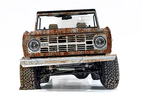 An unrestored 1970 classic, rusted, front view